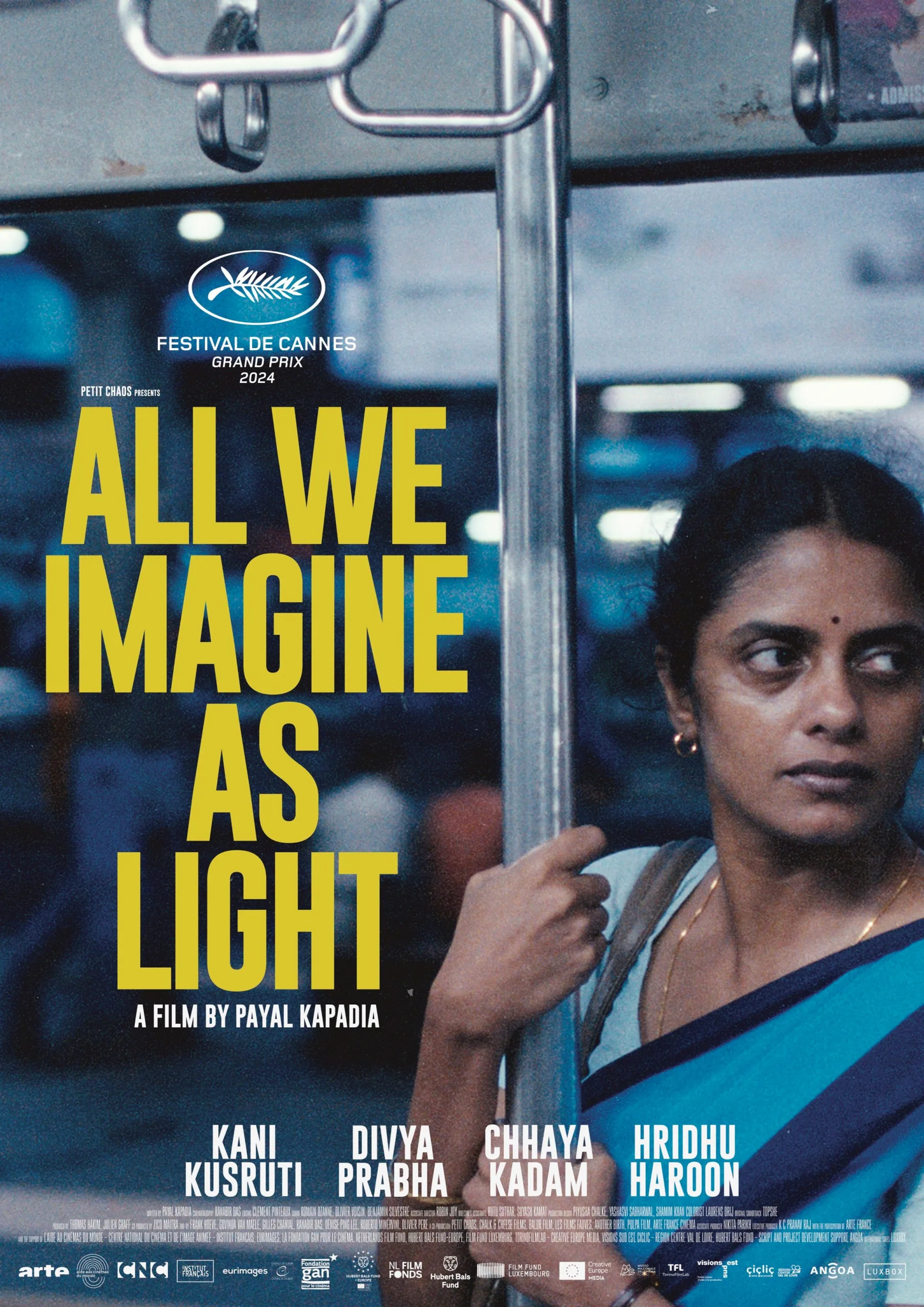 Official international poster for All We Imagine As Light featuring a woman in a sari against a blue background, with large yellow text and the Cannes Film Festival Grand Prix 2024 logo